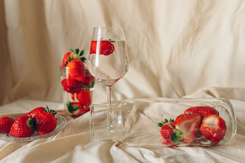 Strawberries in long, thin glasses in a pro photoshoot