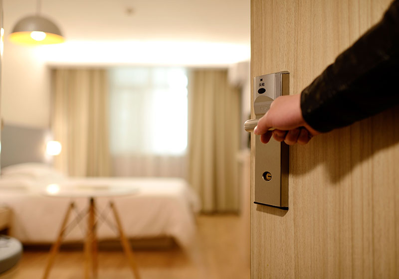 a hotel room seen from a partially open door